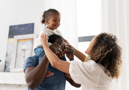 Parents playing with child